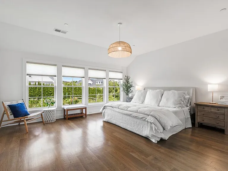 Oversized, light filled primary bedroom w/en-suite bath and custom closet