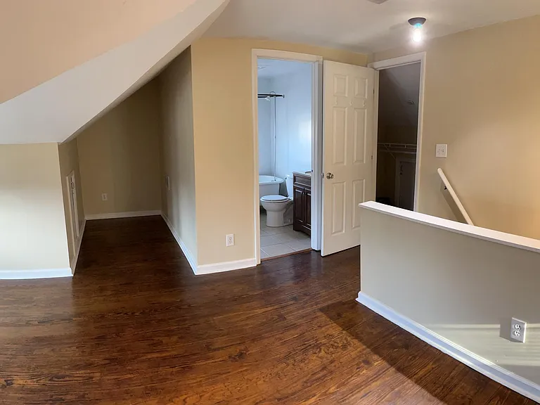 Second floor, view 1 - Open floor plan with full bathroom. Two walk-in closets and extra storage areas.