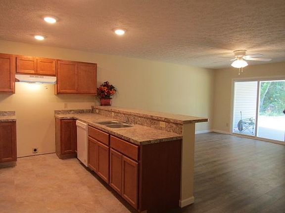 Ten foot breakfast bar will make you the star of entertaining and you will never miss the conversations while you cook! And the entertaining can flow through the patio doors to the great outdoors. What a view from the kitchen and living room!