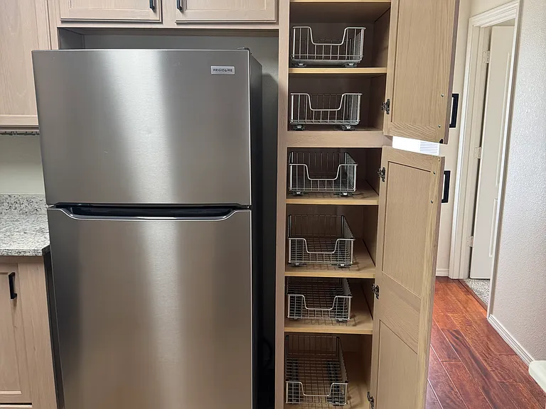 Pantry with sliding baskets.