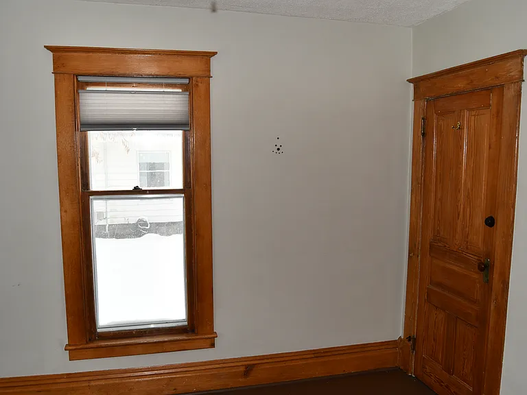 Den or bedroom door leads to bathroom.
