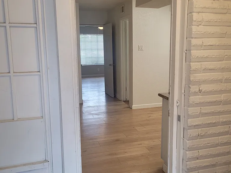 Entrance into kitchen/dining space from back entrance