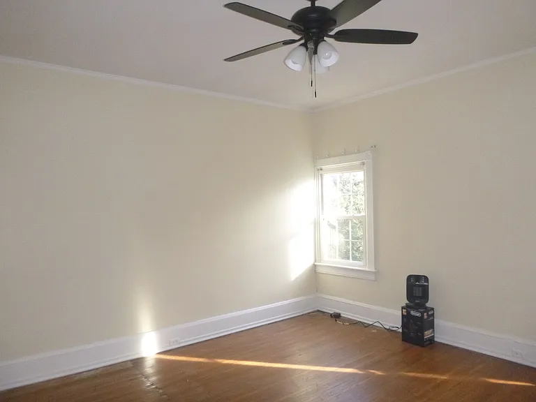 Primary Bedroom is 12x15 with high ceilings and lots of natural light.