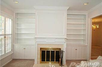 Wainscoting, crown  molding, custom mantle, simply elegant.