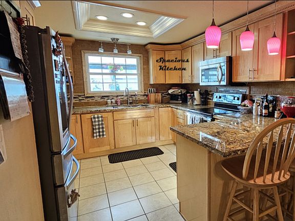 Spacious kitchen with stainless steel appliances