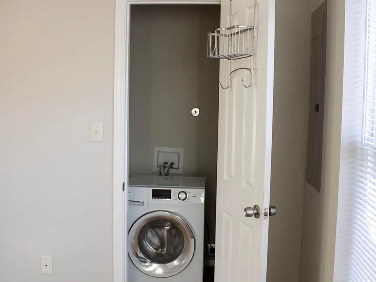 front closet with washer/drier combo