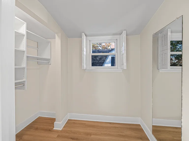 Interior View of Walk-in Closet in Primary Bedroom - Custom Closet