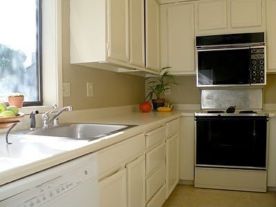 New linoleum and fresh paint in kitchen. 