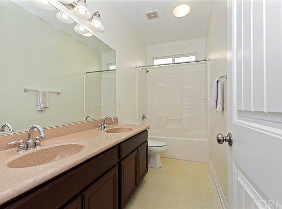 Roomy hall bath with double sinks gives you ample room for kids and their showers.