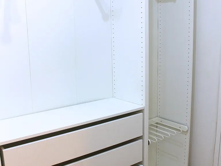 Secondary Walk-In Closet with Built-In Storage