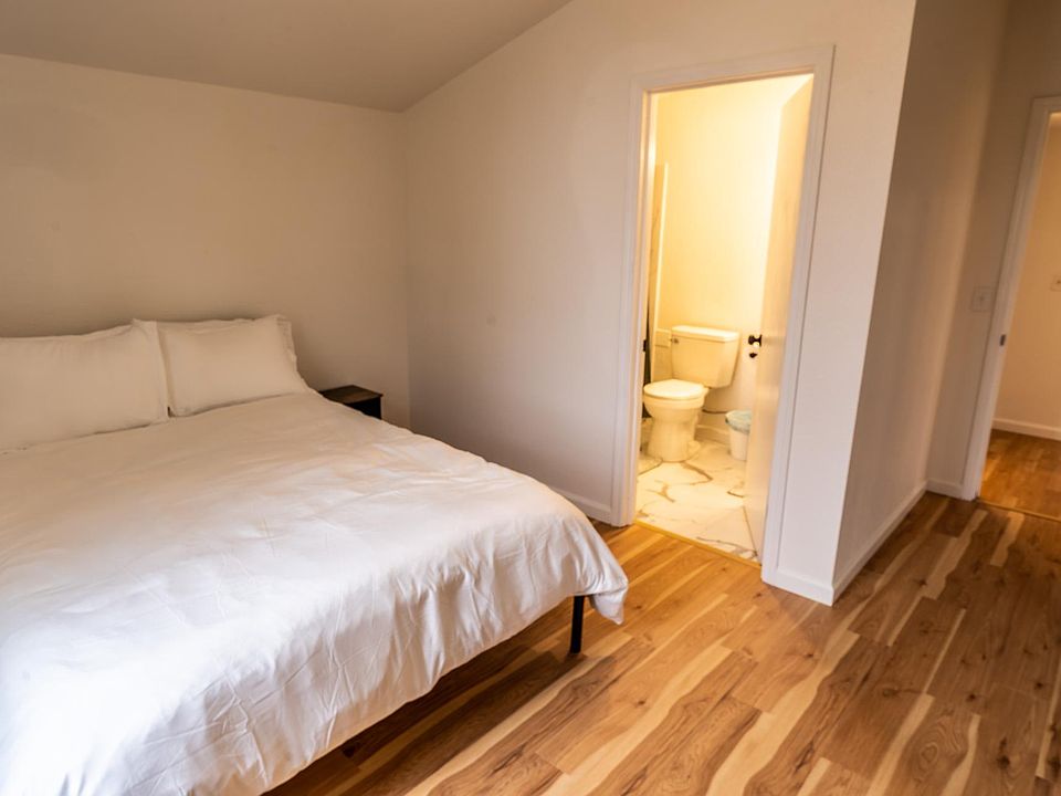 Master bedroom with private bathroom and large closet.