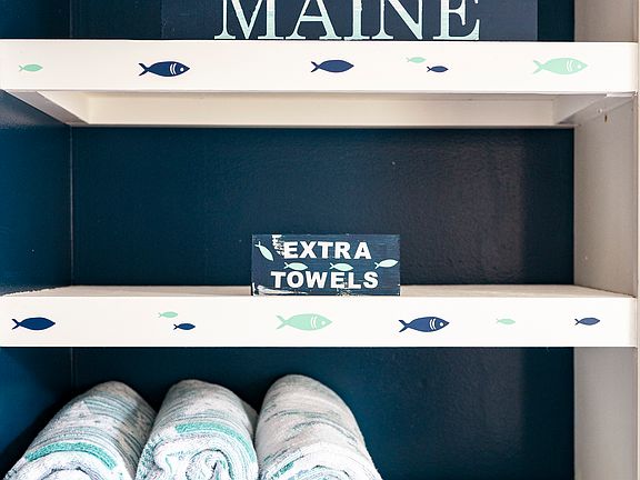 Extra towels , shelves in the laundry room
