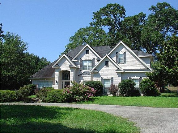 Circular driveway enhances this beautiful elevation.