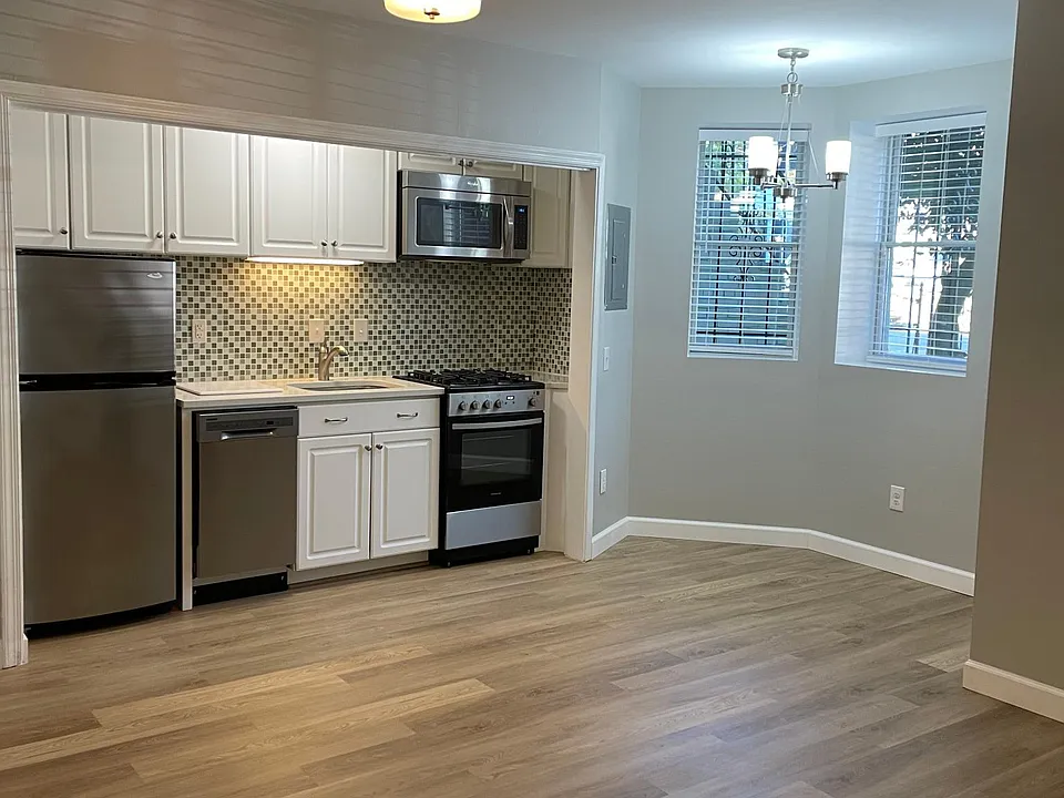 Main living area with front bay window