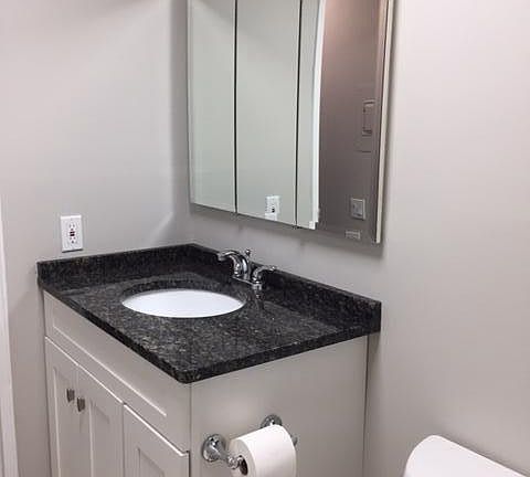 Granite top vanity and large medicine cabinet
