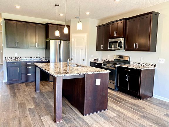 Awesome kitchen with large center island, walk in pantry, upgraded appliances.