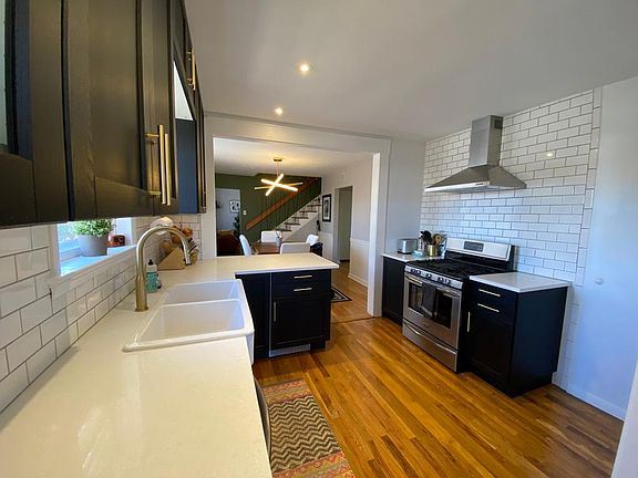 Gorgeous Kitchen with Quartz countertops and brass finishes