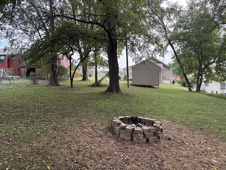 Firepit and big shed in back yard