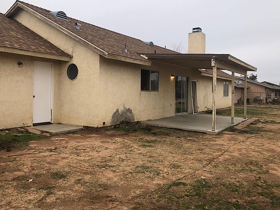 Patio cover with slider door & door leading into Garage