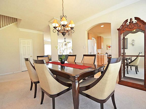 The open and beautifully flowing floor plan now leads us to the formal dining room. Beyond the colum