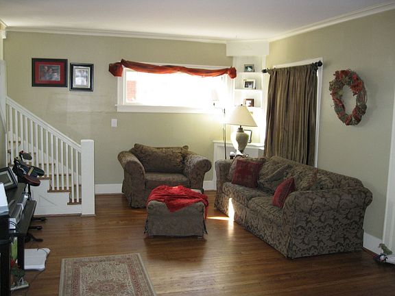 2nd view of living w/wood floors & crown molding