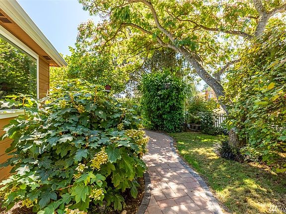 Stroll through your beautifully landscaped yard on your newly installed brick pathway.