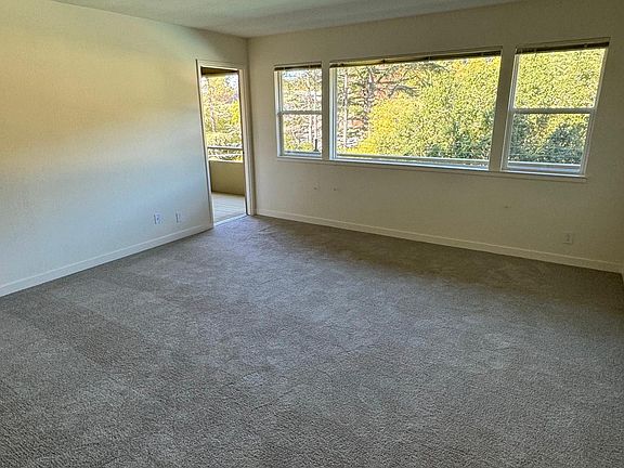 Living room view to outside & deck door