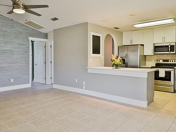 Living room with serving counter from kitchen