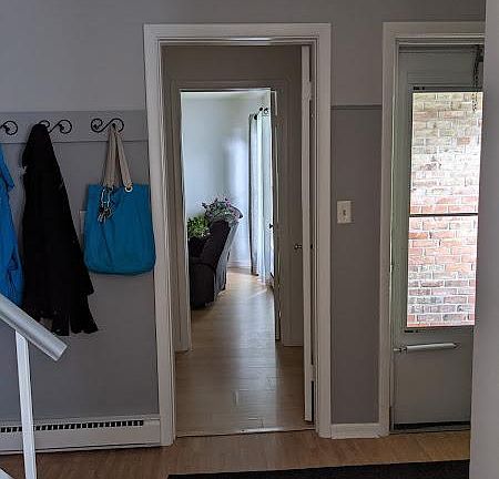 Entrance and downstairs bedroom seen from living room