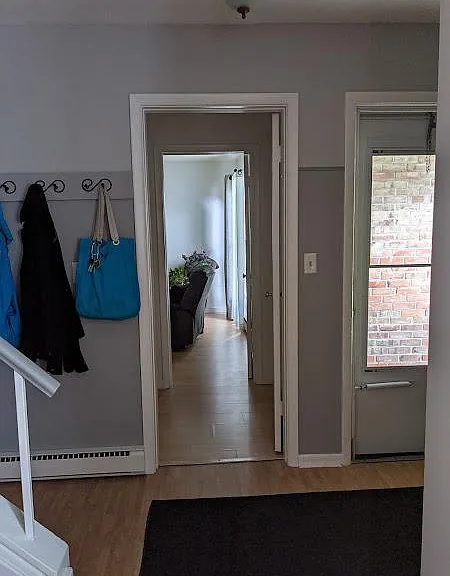 Entrance and downstairs bedroom seen from living room