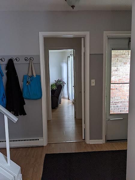 Entrance and downstairs bedroom seen from living room