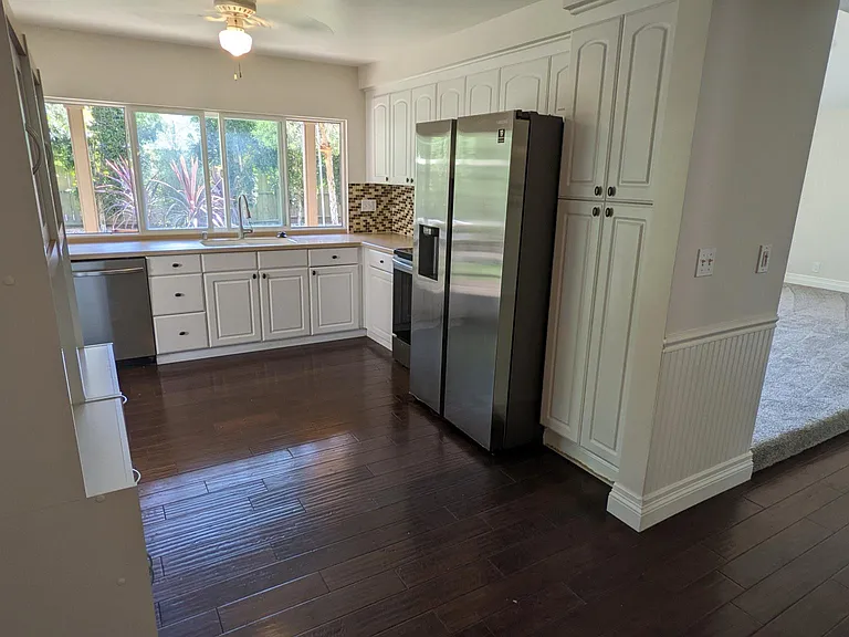 A view of the kitchen adjacent to the living / dining room