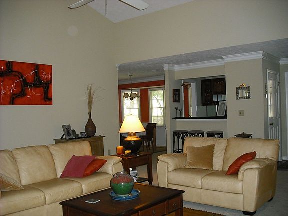 living room, wet bar and dining room