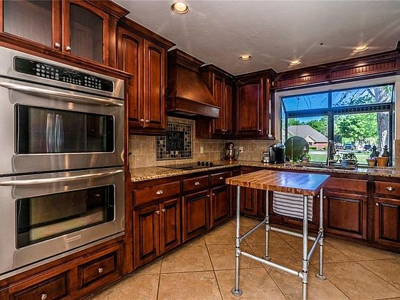 Stainless steel appliances and granite add to the never ending detail of home
