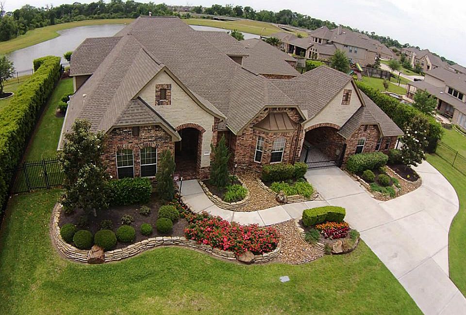 Trendmaker built beauty located on over half an acre lake front lot.