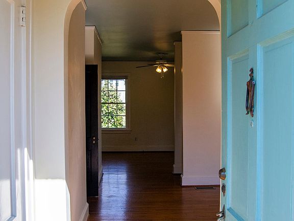 Abundant natural light, hardwoods, and ceiling fans throughout the entire house