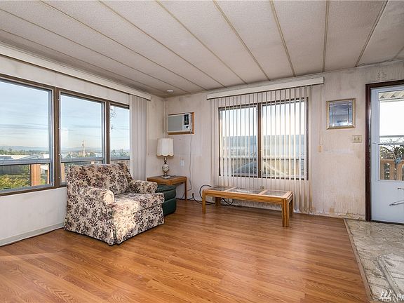 Another living room view showing large windows facing south and east.  You'll enjoy Mt Baker, bay and the islands.  