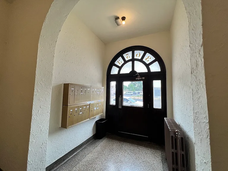 Mail boxes are located next to entrance on Grand.
