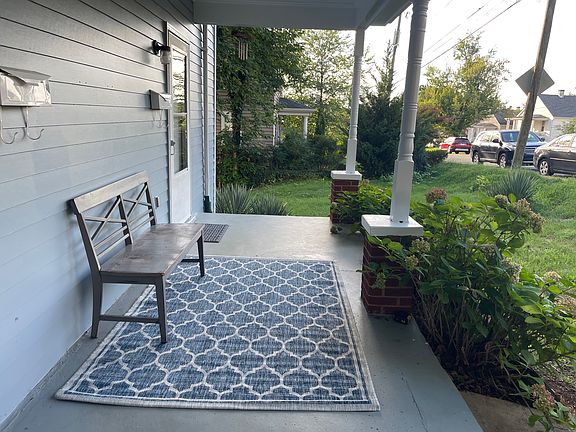 Welcoming covered front porch with space to sit and enjoy the neighborhood