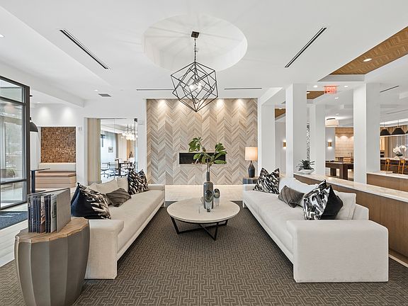 Resident lobby with ample seating, fireplace and flexible coworking space