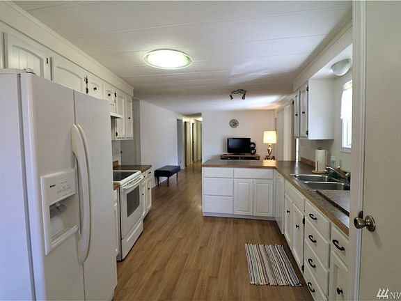 Spacious updated kitchen, panrty with slide out drawers for easy access.
