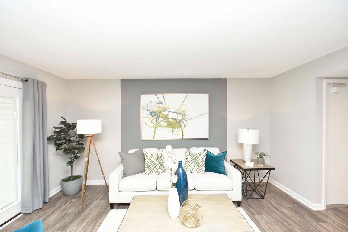Spacious living room with hardwood-style flooring