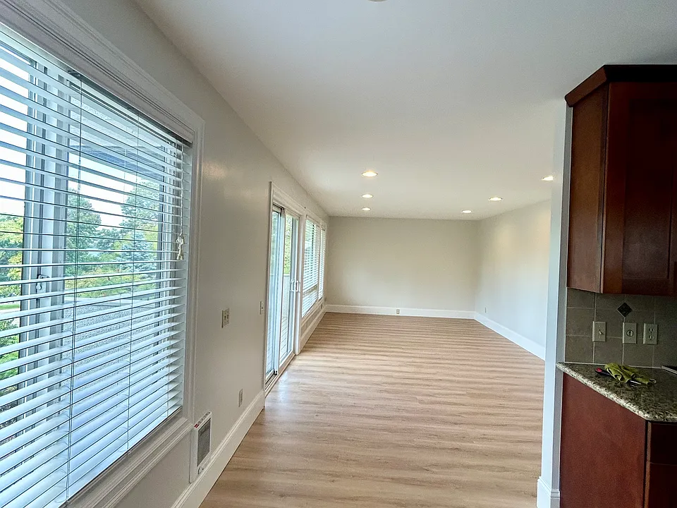 Open floor plan of living room and kitchen area.