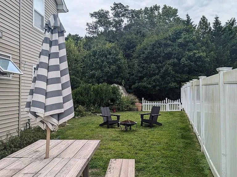 private side yard with patio and gardening area