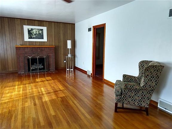 Living room area beautiful hardwood floors. Love the natural light.