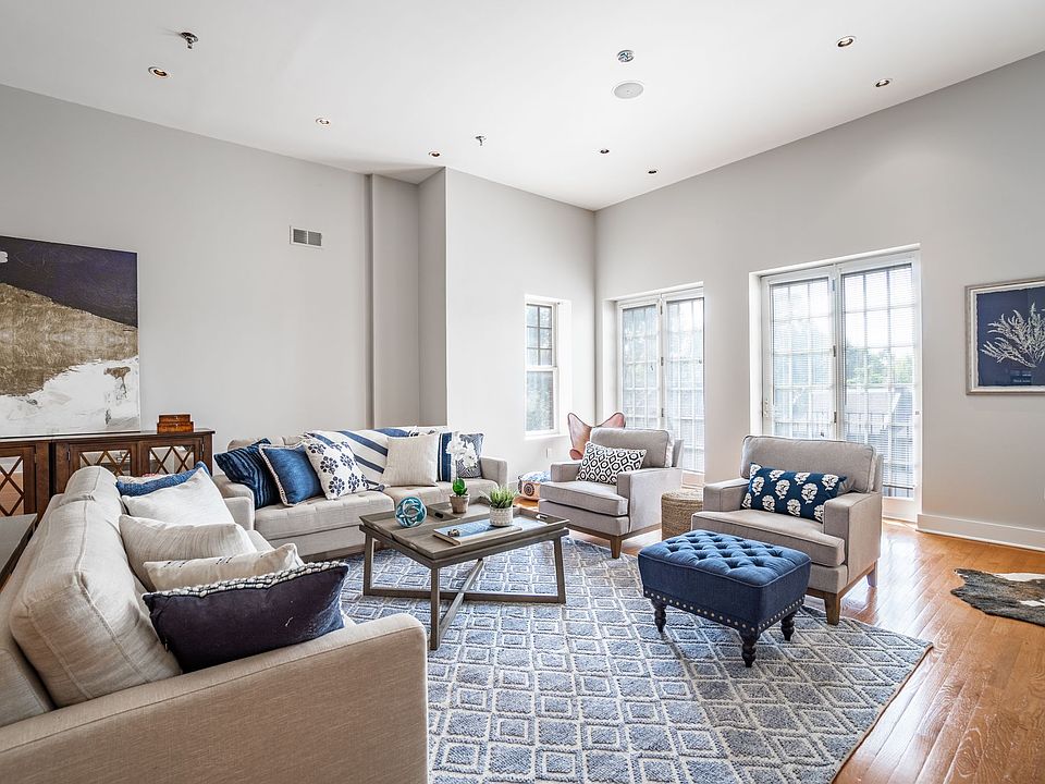 Stunning Layout, soaring high ceilings, Juliet balconies, private balcony, gorgeous hardwood floors, surround sound speaker system installed.
