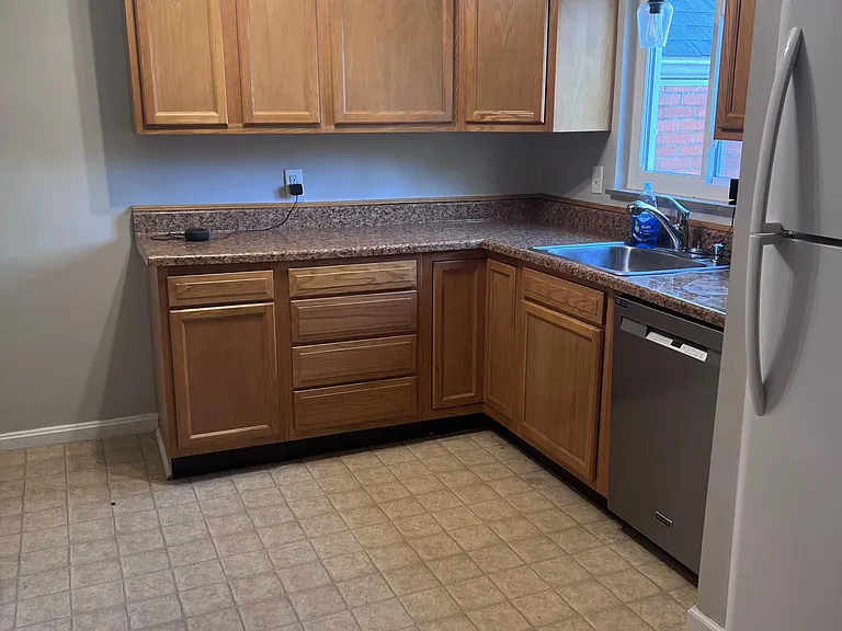 Nice size kitchen with all new lighting, lots of counter space, gas stove and new dishwasher.
