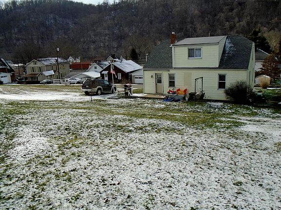 BACK OF HOUSE AND BACKYARD