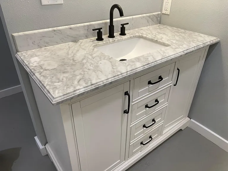 Custom marble topped vanity wth matte black hardware