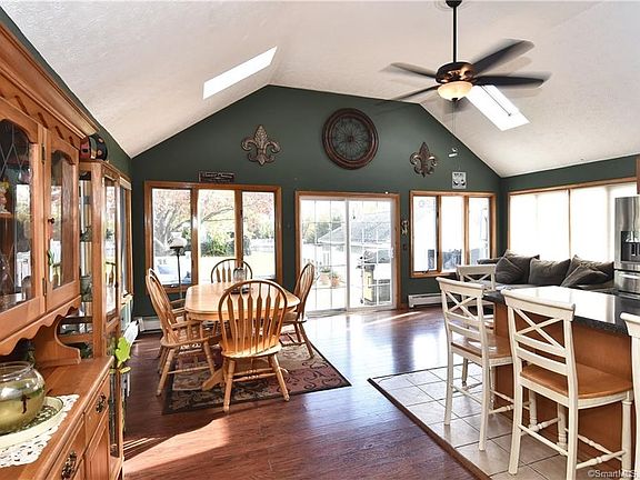 Great room with patio doors to deck and full view of the spacious back yard.  Light from all angles.